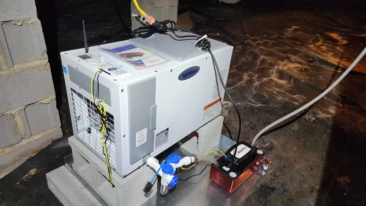 Crawl space dehumidifier installed in an encapsulated crawl space in Raleigh NC